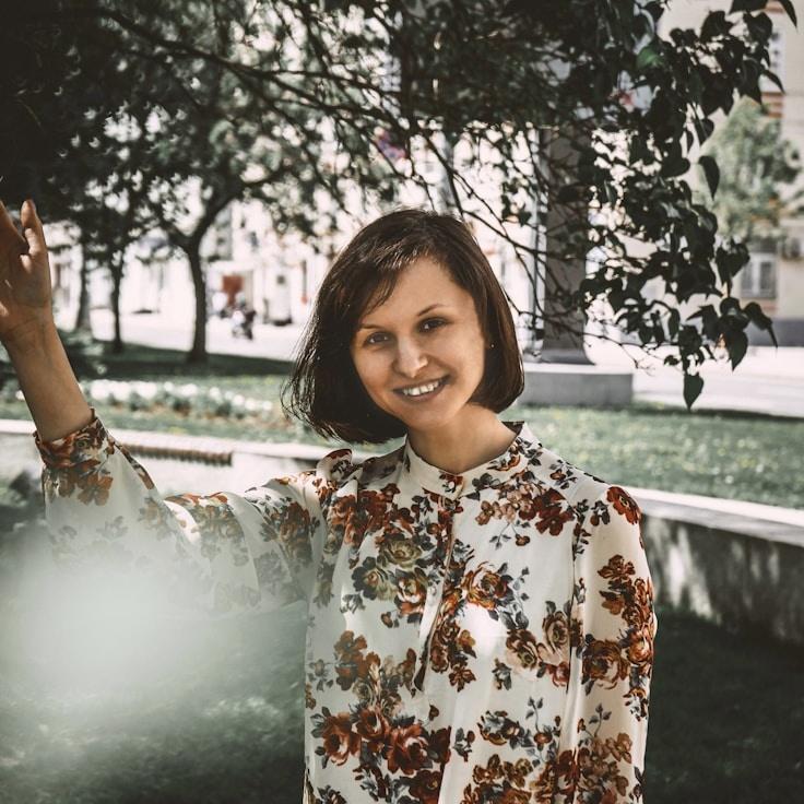 Ariya Sharma, Lead Design Curator at Future Planning Studio, reviewing corporate floral arrangements